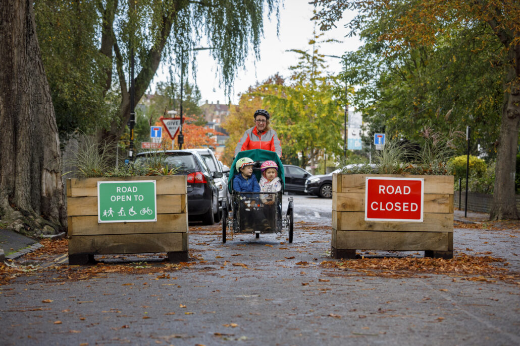Mother with two children in a cargo bike
